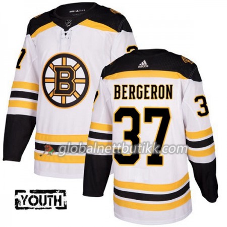 Boston Bruins Hockeydrakt Patrice Bergeron 37 2017-2018 Hvit Adidas Authentic - Barn